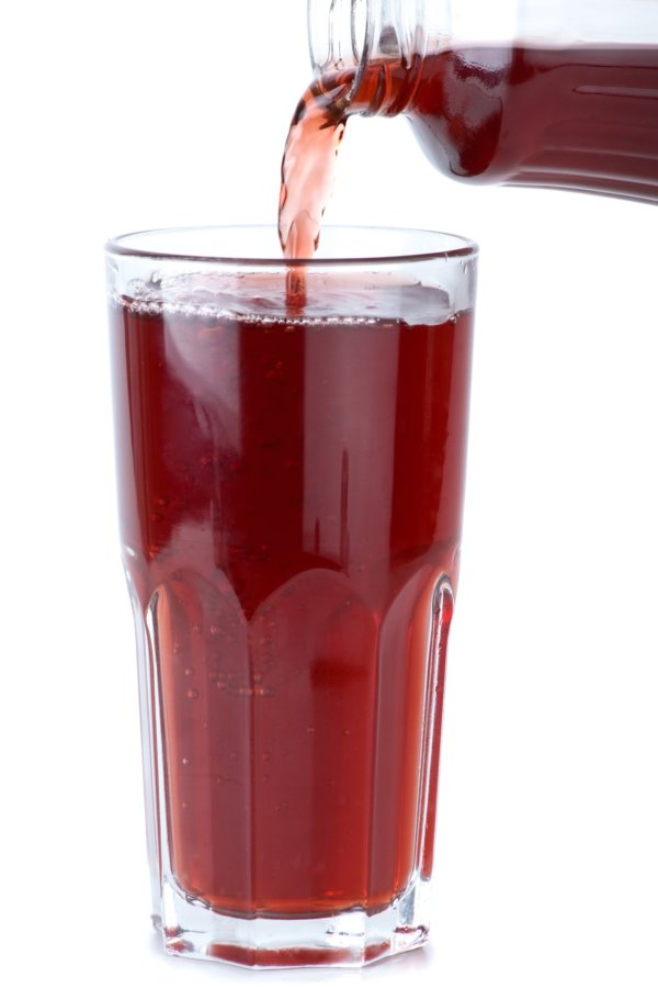 Glass poured with pomegranate juice